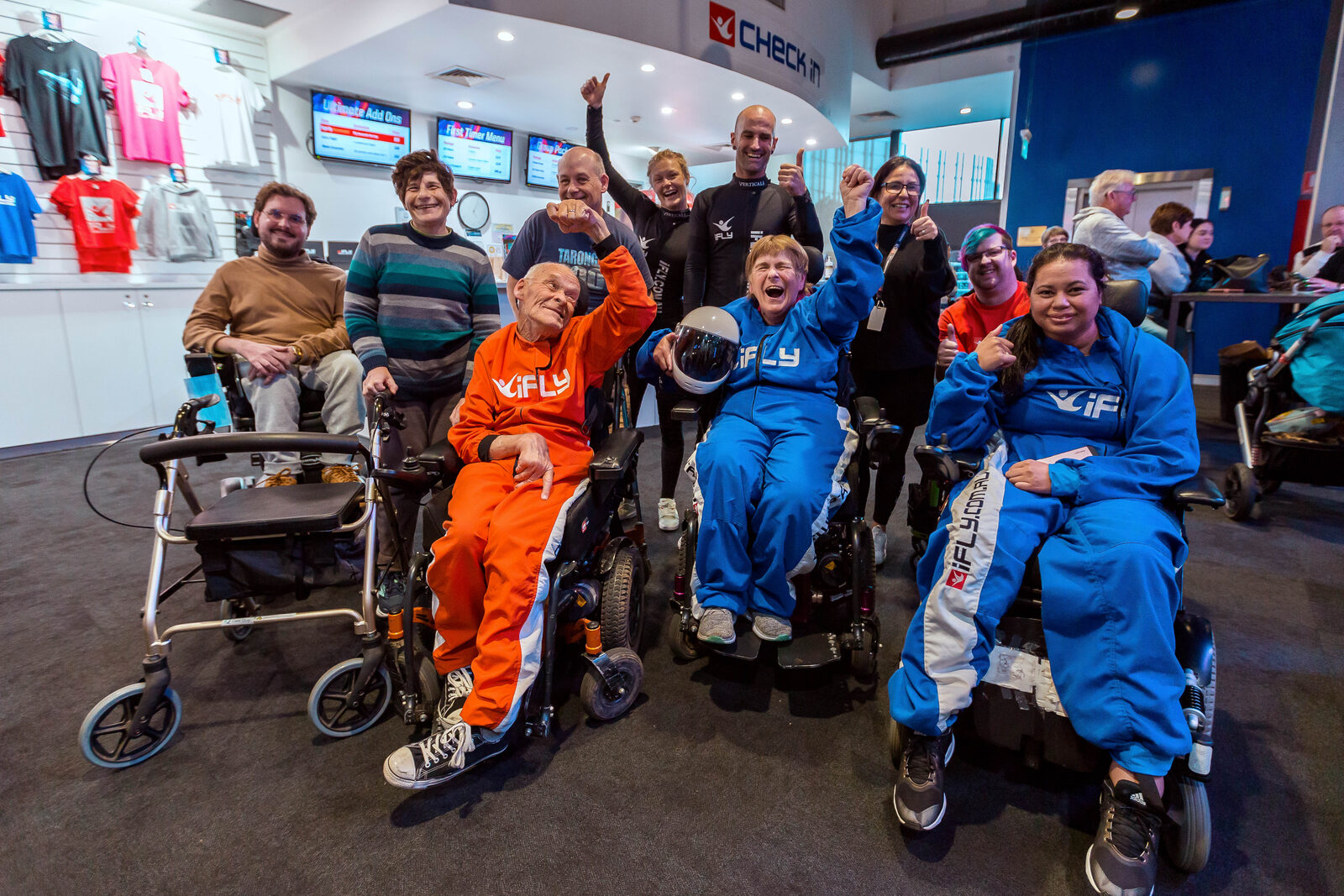 A What Ability Foundation participant indoor skydiving at iFly with two instructors